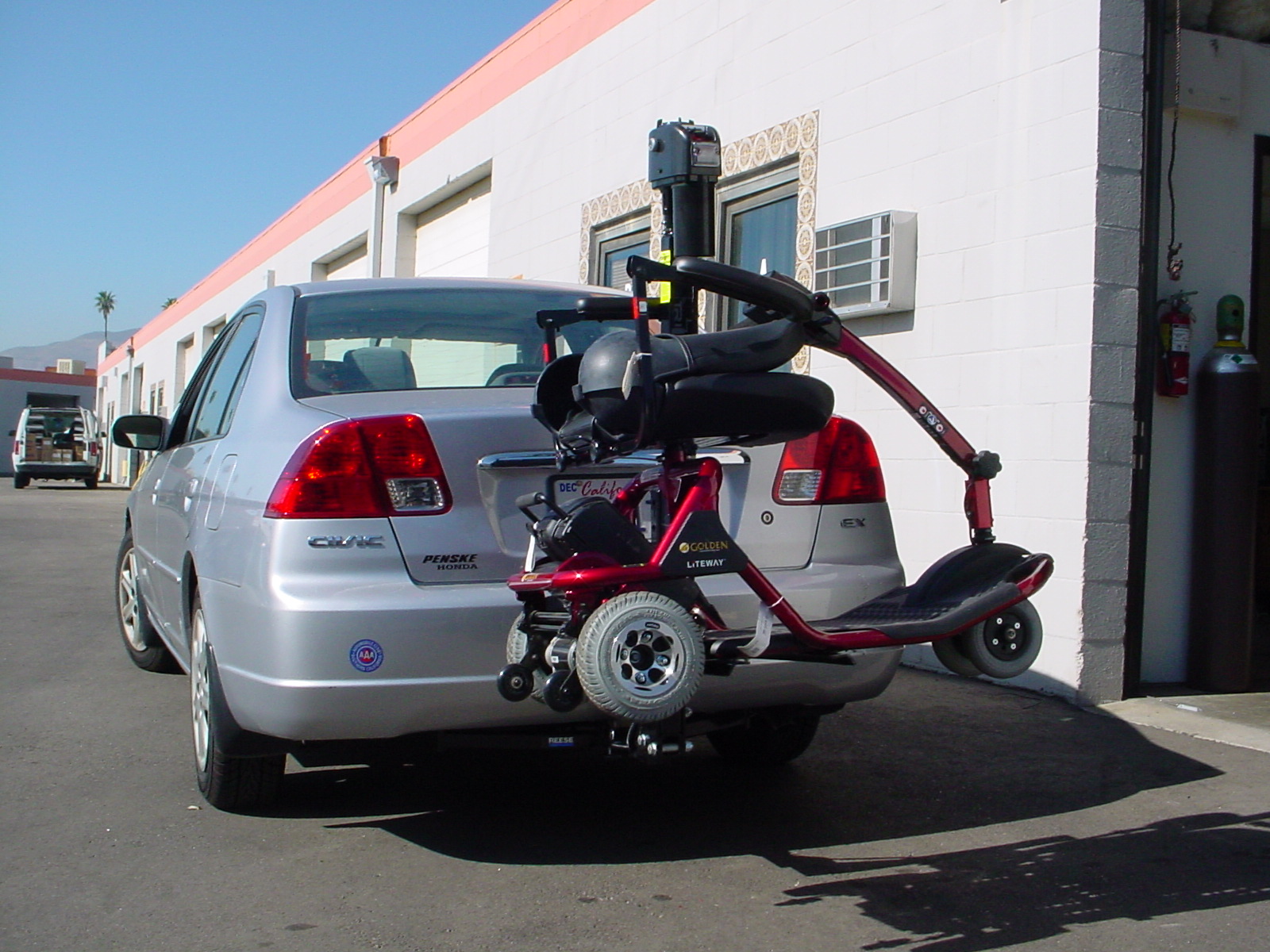 Los Angeles tri lift outside trailer hitch scooter carrier